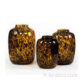 Vaste de verre à fleurs tachetées de léopard